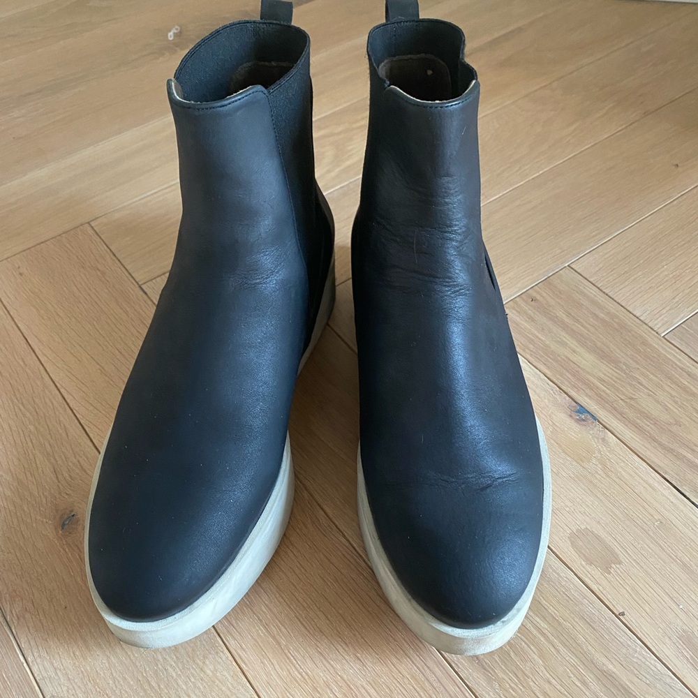 Coclico booties with white rubber soles.
